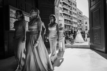 Bridesmaids entering the beautiful church in Almeria, Spain